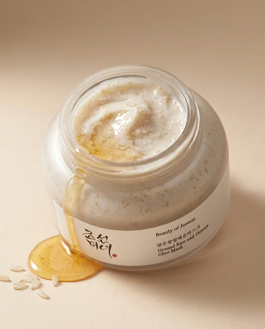 Angle : vue plongeante 35°  Open Beauty of Joseon Ground Rice and Honey Glow Mask jar showing rich creamy texture with visible rice particles, honey drizzle nearby, soft beige background, luxury skincare editorial photography, photorealistic texture details, premium cosmetic campaign. (gemini-3-pro-image-preview)