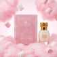 Un plan moyen net et rigoureusement frontal du coffret rose image_30acb9.jpg posé verticalement au centre d'une composition aérienne de fins nuages de barbe à papa rose et de guimauves moelleuses suspendues. Un éclairage de studio vif, pop et diffus illumine la scène, faisant ressortir les frises blanches et le lettrage doré de image_30acb9.jpg sans créer d'ombres dures. Style : Photographie publicitaire de beauté, ludique et haut de gamme. (gemini-3-pro-image-preview)