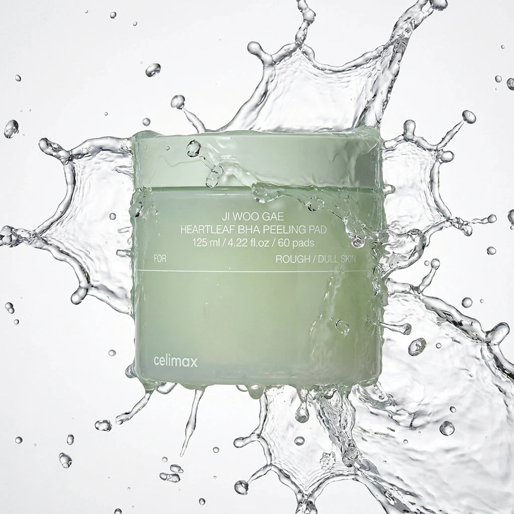 Action commercial photography of Celimax Heartleaf BHA Peeling Pad jar. A crisp, clear, high-speed splash of pure water enveloping the container, capturing frozen water droplets in mid-air. Bright and clean aesthetic, studio lighting, hyper-realistic water physics, professional product presentation --ar 1:1 (gemini-3-pro-image-preview)