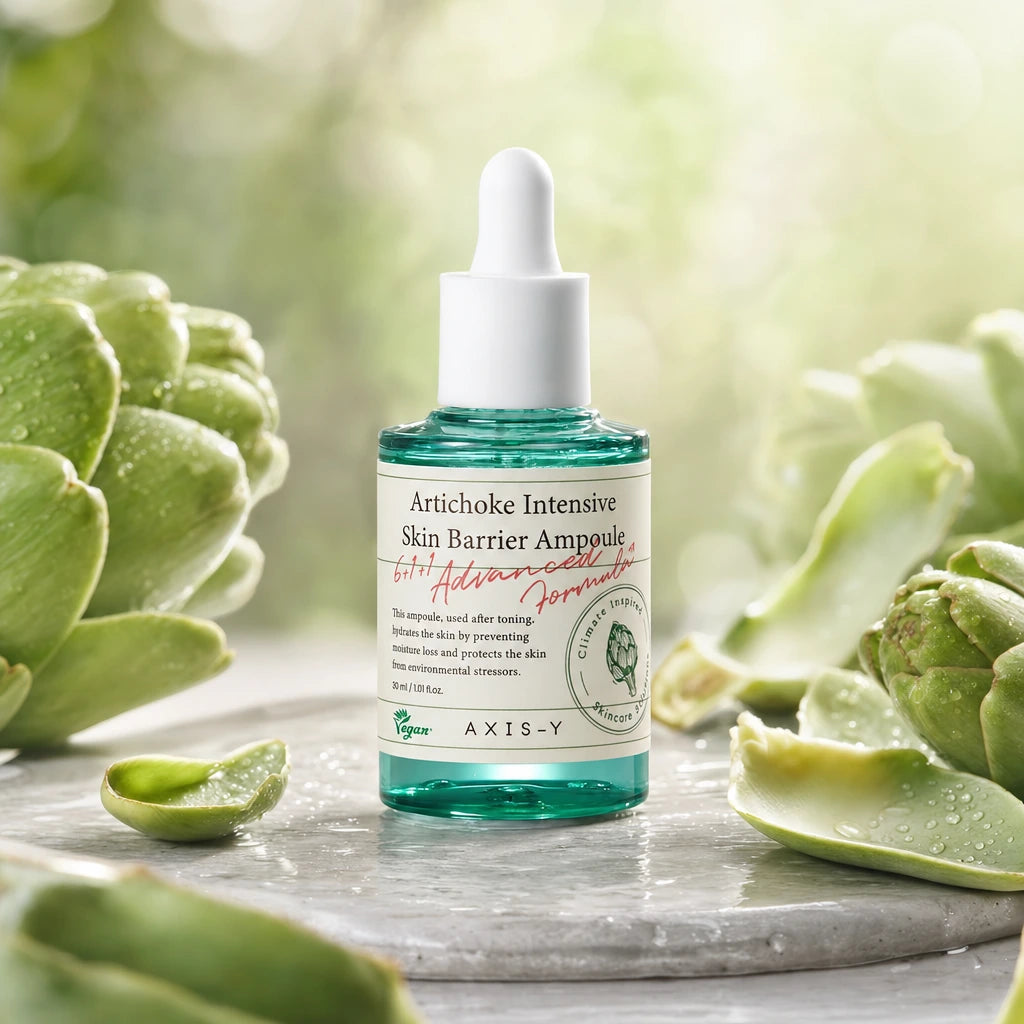 Creative e-commerce shot of the AXIS-Y Artichoke Ampoule bottle inspired by image_46bda2.jpg. The translucent teal glass bottle stands elegantly on a wet light grey stone plate, surrounded by fresh, raw green artichoke leaves with tiny water dew drops glistening on them. In the background, a soft, blurry pastel green and ivory bokeh gradient creates a refreshing, skin-barrier comforting and organic luxury skincare concept under natural morning sunlight. Aspect ratio 1:1, size 1200x1200px. (gpt-image-2)