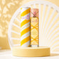 Vibrant e-commerce product shot of Pink Sugar Creamy Sunshine perfume. The bottle stands on a smooth, modern pastel yellow podium. In the background, an abstract, minimalist white arch simulates a sun ray pattern. Soft, elegant shadows, clean lines, contemporary beauty boutique style, joyful and sunny vibe. Aspect ratio 1:1, size 1200x1200px. (gpt-image-2)